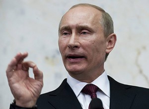 Vladimir Putin gestures during a news conference at Sweden's government headquarters Rosenbad in Stockholm
