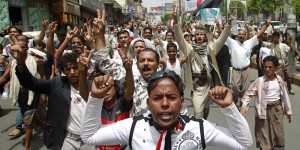 Anti-government protesters shout slogans during a demonstration to demand the ouster of Yemen's President Ali Abdullah Saleh in Taiz